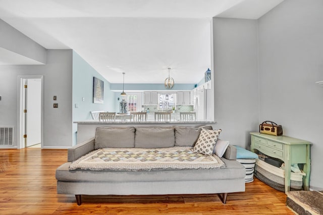 3783 Praline Pl, Roanoke, VA 24012 - living area with light wood-style floors and a chandelier
