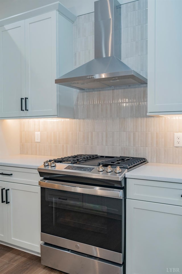 1750 Willow Oak Dr, Forest, VA 24551 - kitchen with backsplash, light countertops, gas stove, and wall chimney exhaust hood