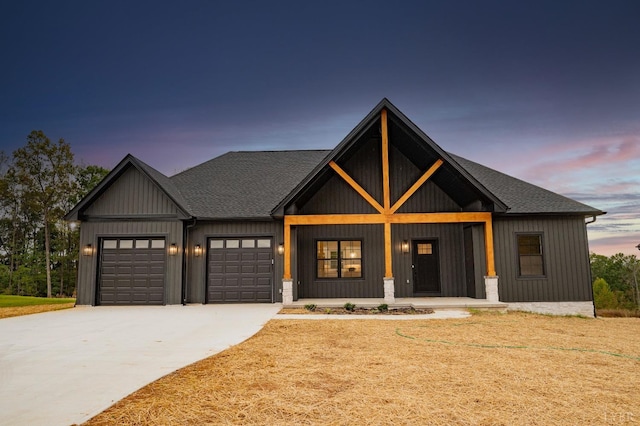 1750 Willow Oak Dr, Forest, VA 24551 - modern farmhouse style home featuring a front lawn, a garage, a shingled roof, covered porch, and driveway