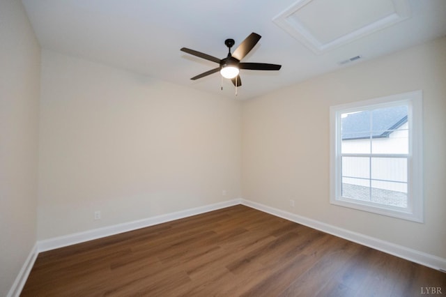 1750 Willow Oak Dr, Forest, VA 24551 - empty room with attic access, dark wood-style flooring, ceiling fan, visible vents, and baseboards