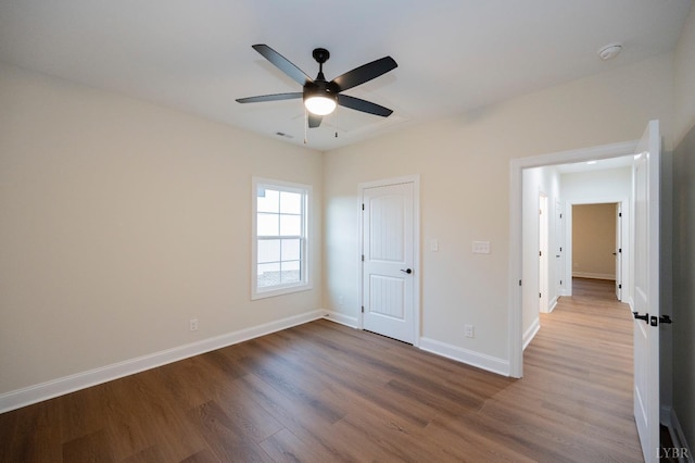1750 Willow Oak Dr, Forest, VA 24551 - unfurnished bedroom featuring baseboards, visible vents, wood finished floors, and ceiling fan