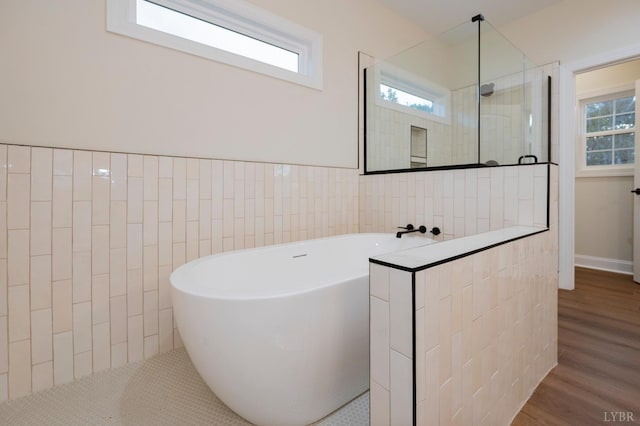 1750 Willow Oak Dr, Forest, VA 24551 - full bath with a freestanding tub, wood finished floors, a healthy amount of sunlight, and tiled shower