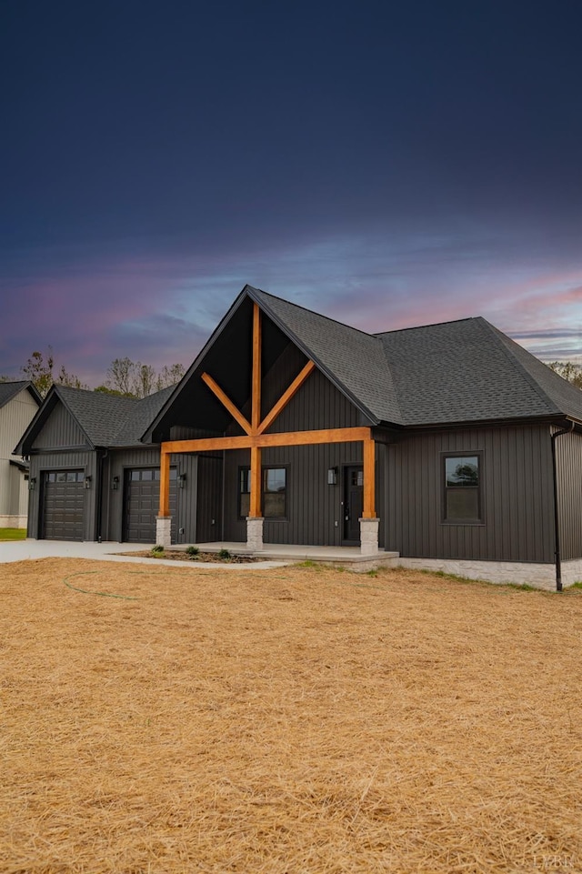 1750 Willow Oak Dr, Forest, VA 24551 - modern farmhouse featuring driveway, roof with shingles, and a garage