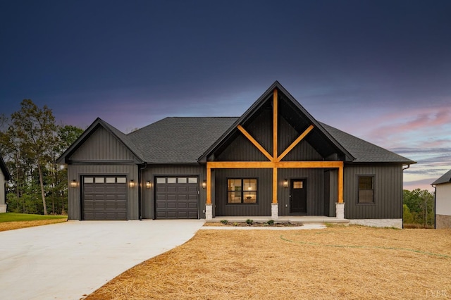 modern farmhouse style home with covered porch, roof with shingles, a front lawn, concrete driveway, and an attached garage