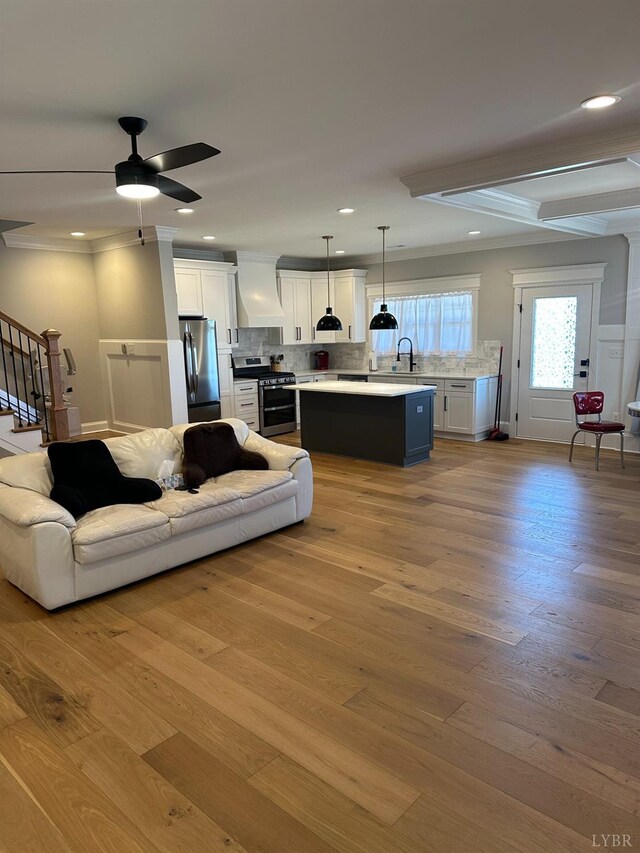 1022 N Westyn Loop, Forest, VA 24551 - living room with stairs, ceiling fan, light wood finished floors, and crown molding