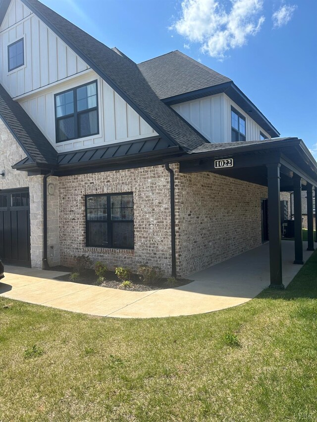 1022 N Westyn Loop, Forest, VA 24551 - view of property exterior featuring a yard, board and batten siding, brick siding, and roof with shingles