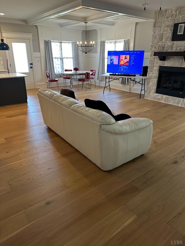1022 N Westyn Loop, Forest, VA 24551 - living area with wood finished floors, coffered ceiling, crown molding, a decorative wall, and a chandelier