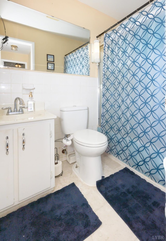 139 Old Main St, Brookneal, VA 24528 - bathroom with vanity, tile patterned floors, tile walls, a wainscoted wall, and a shower with curtain