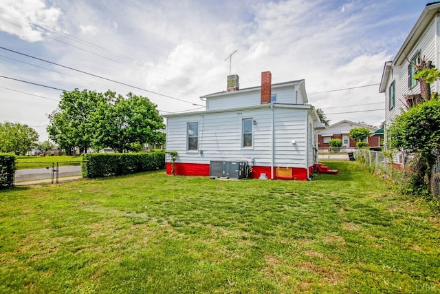 1518 14th St, Lynchburg, VA 24501 - back of house featuring a fenced backyard and a chimney