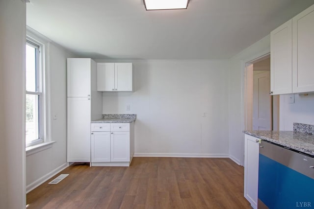 1518 14th St, Lynchburg, VA 24501 - kitchen with dark wood-style floors, plenty of natural light, white cabinetry, and light stone countertops