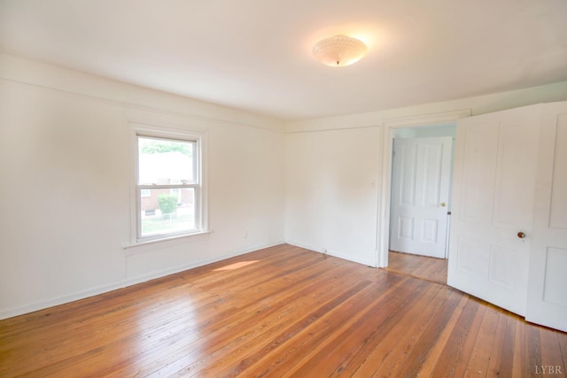 1518 14th St, Lynchburg, VA 24501 - empty room with light wood-style floors and baseboards