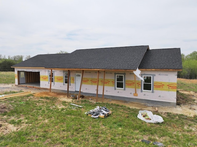 2308 Smith Mountain Lake Pkwy, Huddleston, VA 24104 - rear view of house featuring roof with shingles and a lawn