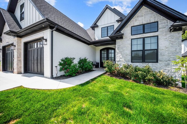 301 Bentley Grove Way, Lynchburg, VA 24502 - view of front of property featuring board and batten siding, stone siding, a front yard, and a shingled roof