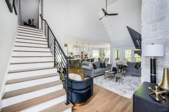 301 Bentley Grove Way, Lynchburg, VA 24502 - living area with high vaulted ceiling, ceiling fan, light wood-style flooring, and stairs