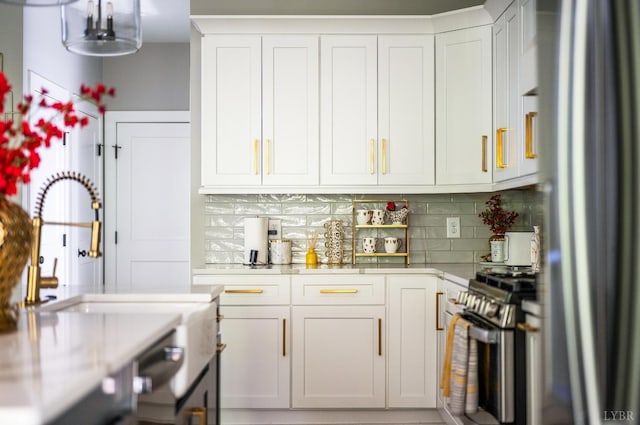 301 Bentley Grove Way, Lynchburg, VA 24502 - kitchen with stainless steel appliances, light countertops, decorative backsplash, and white cabinetry