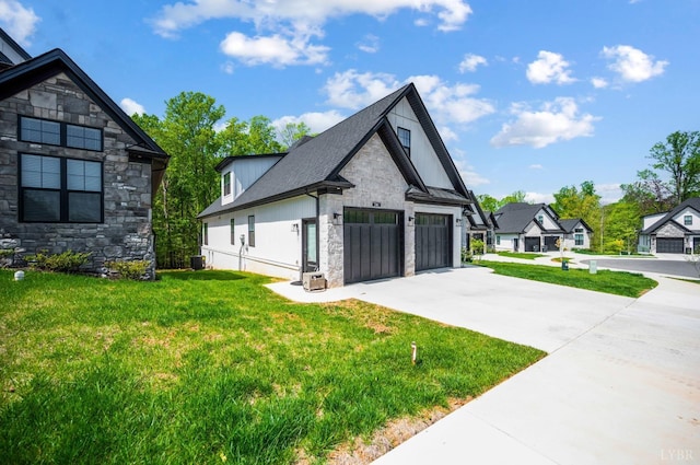 301 Bentley Grove Way, Lynchburg, VA 24502 - view of side of home featuring stone siding, driveway, a yard, and an attached garage