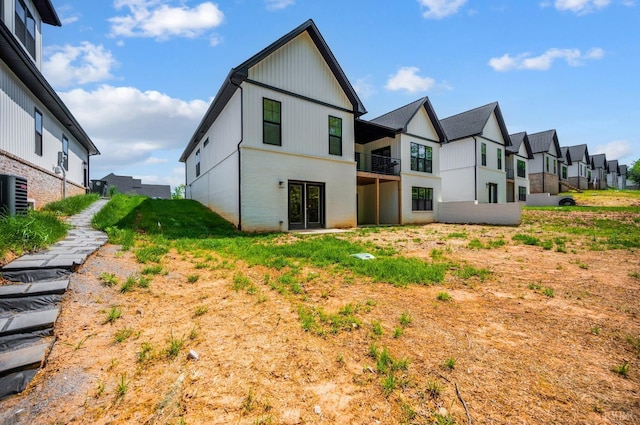 301 Bentley Grove Way, Lynchburg, VA 24502 - back of property featuring a residential view, central air condition unit, a balcony, and brick siding