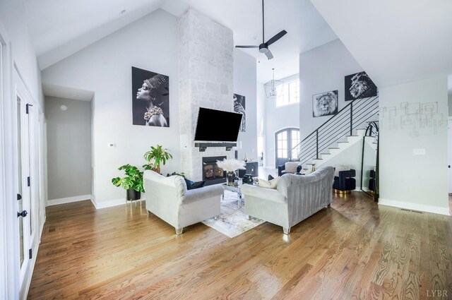 301 Bentley Grove Way, Lynchburg, VA 24502 - living area with high vaulted ceiling, stairs, light wood finished floors, ceiling fan, and a fireplace