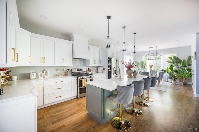 301 Bentley Grove Way, Lynchburg, VA 24502 - kitchen featuring stainless steel appliances, custom exhaust hood, a kitchen bar, decorative backsplash, and recessed lighting