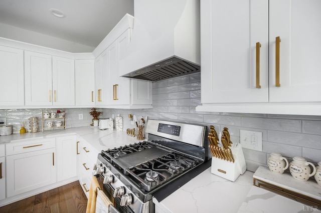 301 Bentley Grove Way, Lynchburg, VA 24502 - kitchen with stainless steel range with gas stovetop, custom exhaust hood, light stone counters, white cabinetry, and decorative backsplash