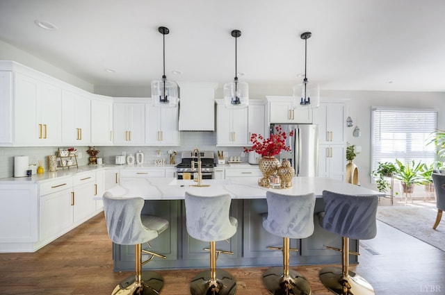 301 Bentley Grove Way, Lynchburg, VA 24502 - kitchen featuring stainless steel appliances, tasteful backsplash, white cabinets, a kitchen breakfast bar, and recessed lighting