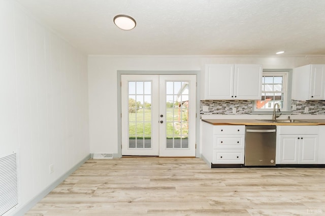 3677 Grit Rd, Hurt, VA 24563 - kitchen featuring dishwasher, french doors, a sink, white cabinets, and tasteful backsplash