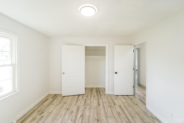 3677 Grit Rd, Hurt, VA 24563 - unfurnished bedroom featuring light wood-style floors, baseboards, and a closet