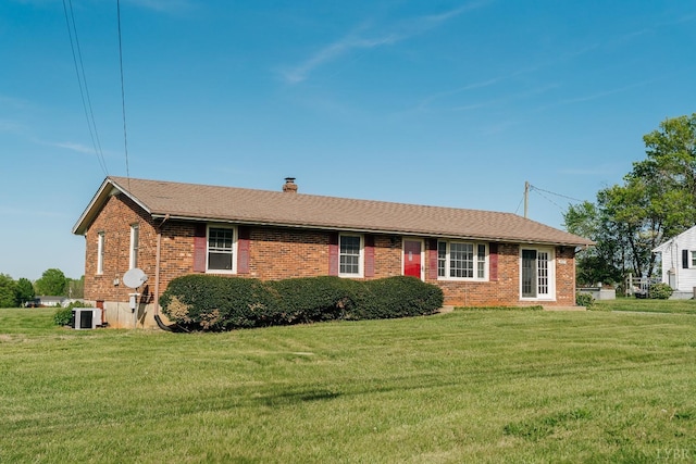 3677 Grit Rd, Hurt, VA 24563 - single story home featuring brick siding, a front yard, a chimney, and central air condition unit