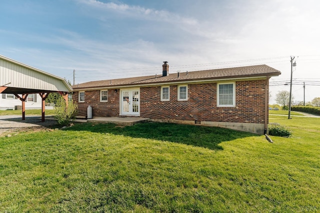 3677 Grit Rd, Hurt, VA 24563 - rear view of property featuring a lawn, brick siding, french doors, and roof with shingles