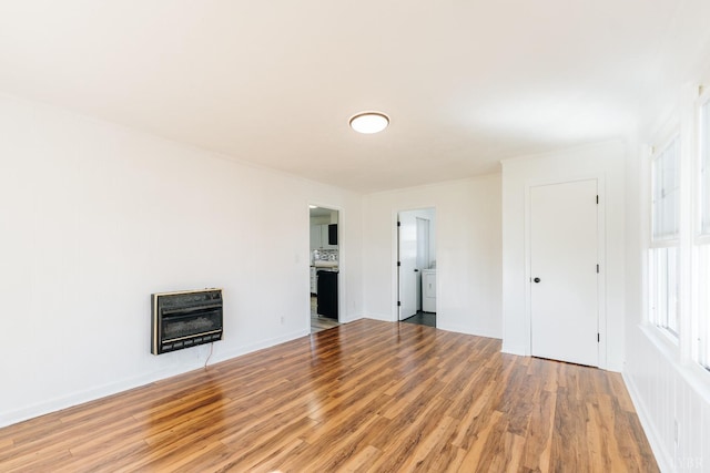 3677 Grit Rd, Hurt, VA 24563 - unfurnished living room featuring heating unit, light wood finished floors, a fireplace, and baseboards