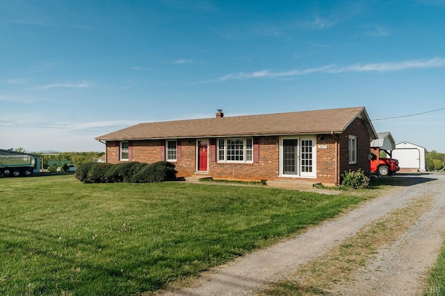 3677 Grit Rd, Hurt, VA 24563 - ranch-style home featuring brick siding, an outbuilding, a front lawn, driveway, and a chimney