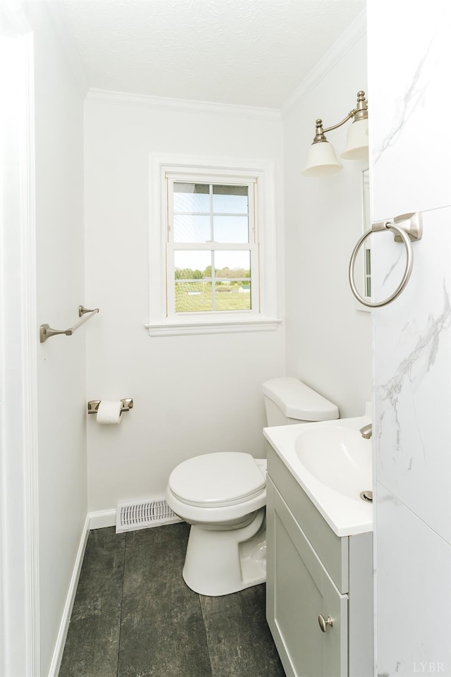 3677 Grit Rd, Hurt, VA 24563 - bathroom featuring vanity, crown molding, toilet, and baseboards
