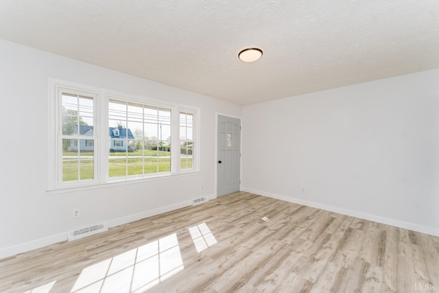 3677 Grit Rd, Hurt, VA 24563 - unfurnished room featuring wood finished floors, baseboards, and a textured ceiling