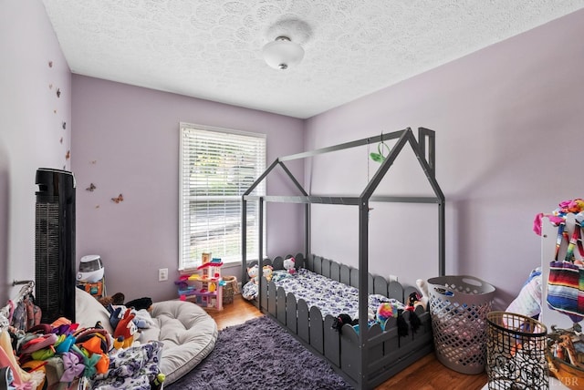 119 Adams Dr, Lynchburg, VA 24502 - bedroom featuring wood finished floors and a textured ceiling