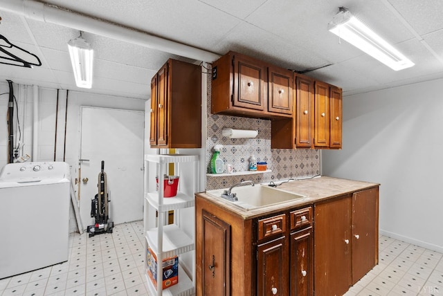 119 Adams Dr, Lynchburg, VA 24502 - kitchen with washer / dryer, a sink, light flooring, light countertops, and a paneled ceiling