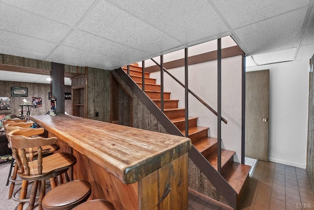 119 Adams Dr, Lynchburg, VA 24502 - indoor dry bar featuring stairs, a drop ceiling, baseboards, and tile patterned flooring