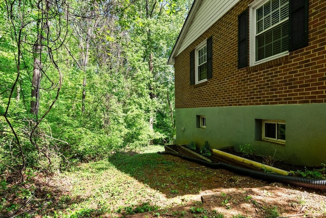 119 Adams Dr, Lynchburg, VA 24502 - view of home's exterior with brick siding and a view of trees