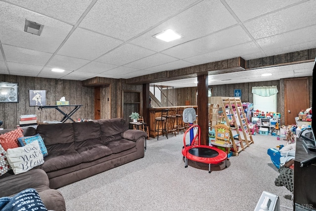 119 Adams Dr, Lynchburg, VA 24502 - carpeted living area featuring a paneled ceiling and wooden walls