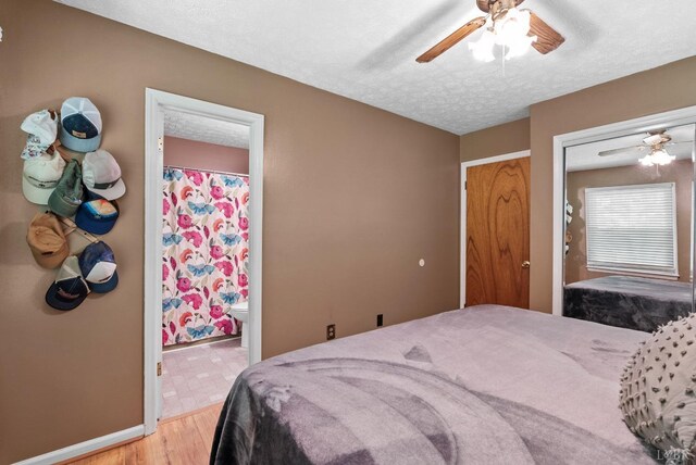 119 Adams Dr, Lynchburg, VA 24502 - bedroom featuring light wood-type flooring, baseboards, a textured ceiling, ceiling fan, and ensuite bathroom