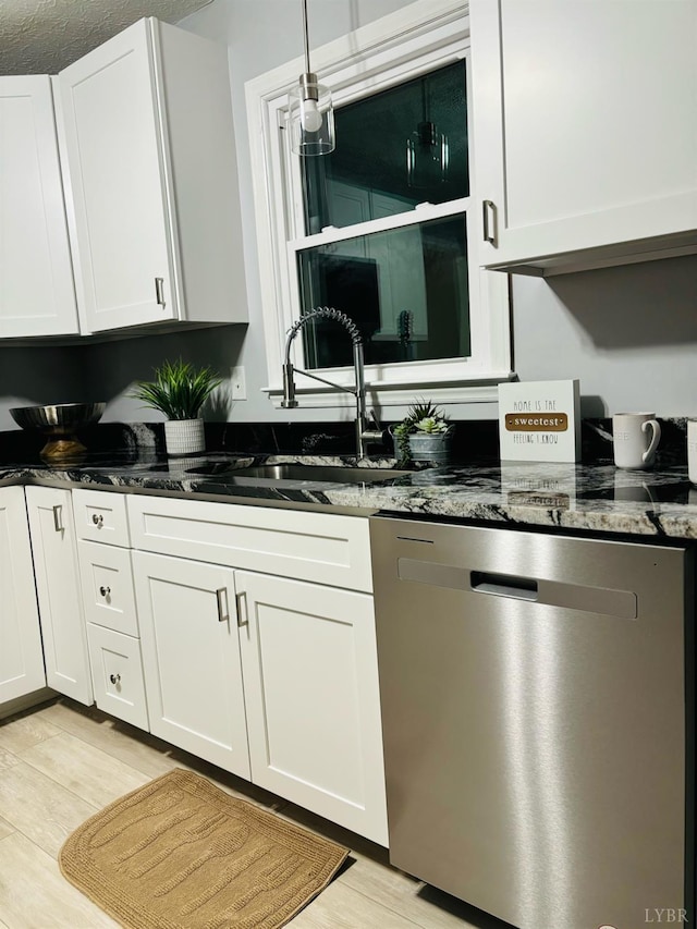 1172 Golden Leaf Rd, Nathalie, VA 24577 - kitchen with stainless steel dishwasher, a sink, white cabinets, dark stone counters, and light wood-style floors