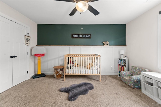 bedroom featuring a closet, carpet, and ceiling fan