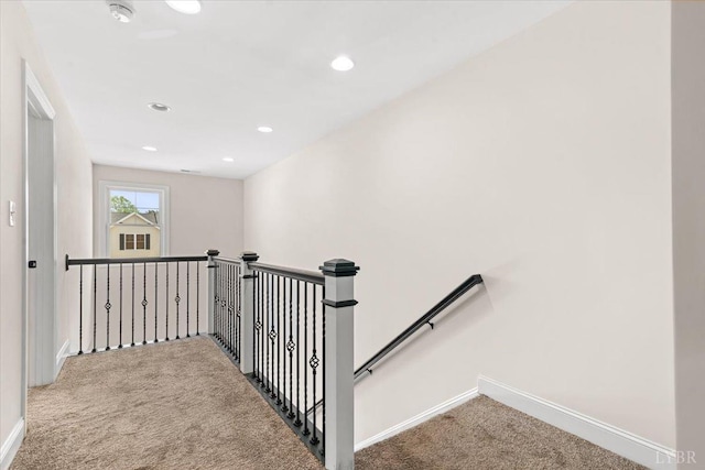 staircase with carpet floors, recessed lighting, and baseboards