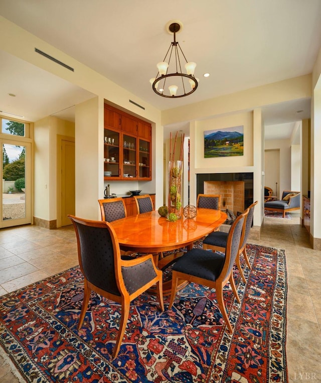 1209 Sycamore Creek Dr, Goode, VA 24556 - dining room featuring baseboards, a chandelier, and visible vents