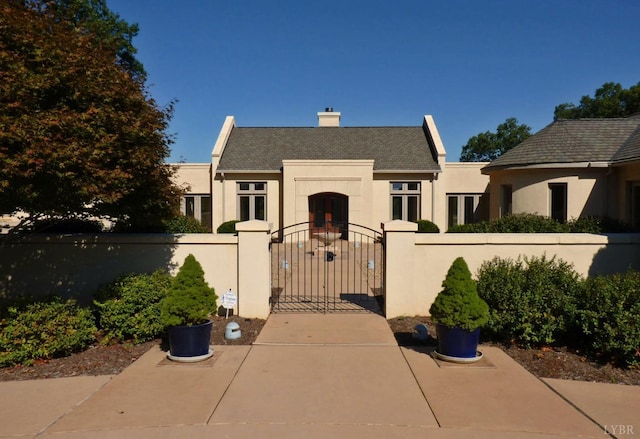 1209 Sycamore Creek Dr, Goode, VA 24556 - view of front of property with fence private yard, a gate, stucco siding, and a chimney