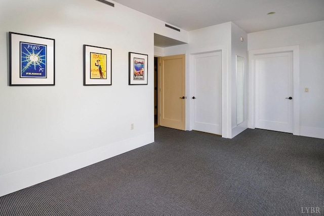 1209 Sycamore Creek Dr, Goode, VA 24556 - unfurnished room featuring baseboards, visible vents, and dark carpet