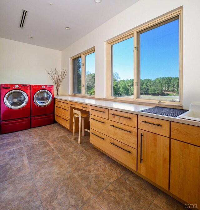 1209 Sycamore Creek Dr, Goode, VA 24556 - washroom featuring washing machine and clothes dryer, dark tile patterned flooring, visible vents, and cabinet space