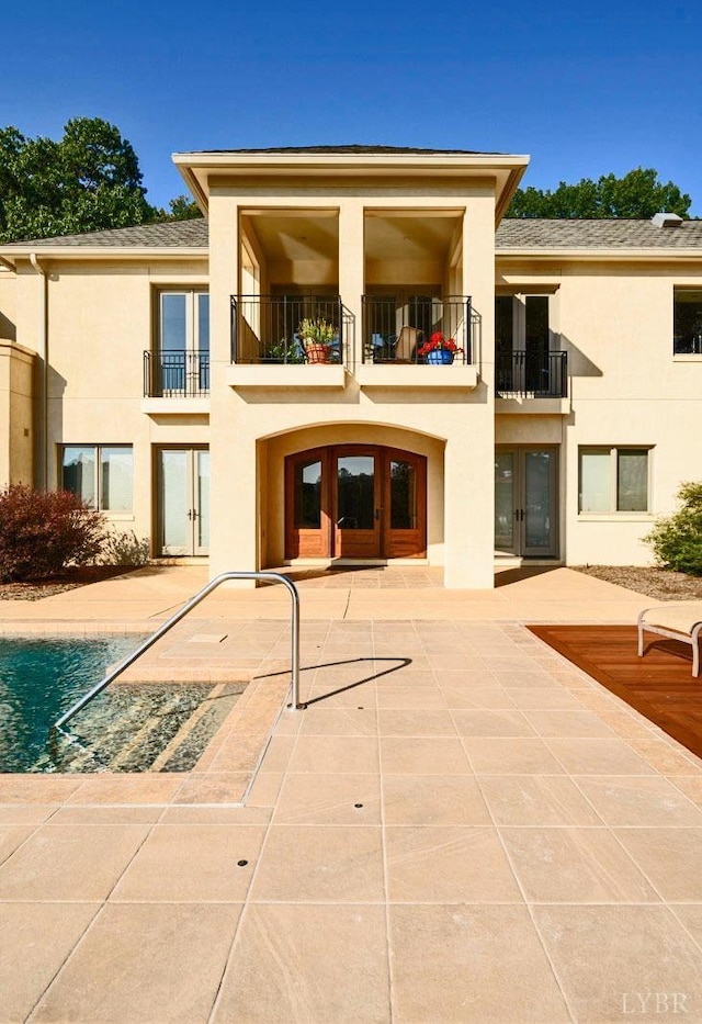 1209 Sycamore Creek Dr, Goode, VA 24556 - back of house with french doors, a balcony, a patio area, and stucco siding