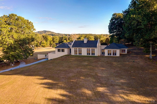 1209 Sycamore Creek Dr, Goode, VA 24556 - view of front of house featuring french doors, a chimney, and a front lawn