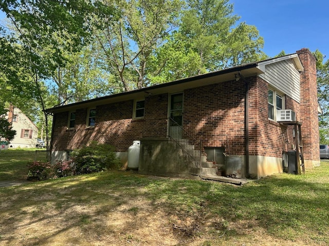 116 Carson St, Brookneal, VA 24528 - view of property exterior featuring a chimney, brick siding, and a yard