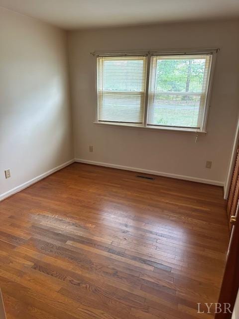 116 Carson St, Brookneal, VA 24528 - spare room featuring plenty of natural light, wood finished floors, and baseboards